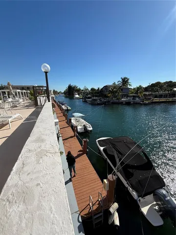 a view of a patio with swimming pool table and chairs