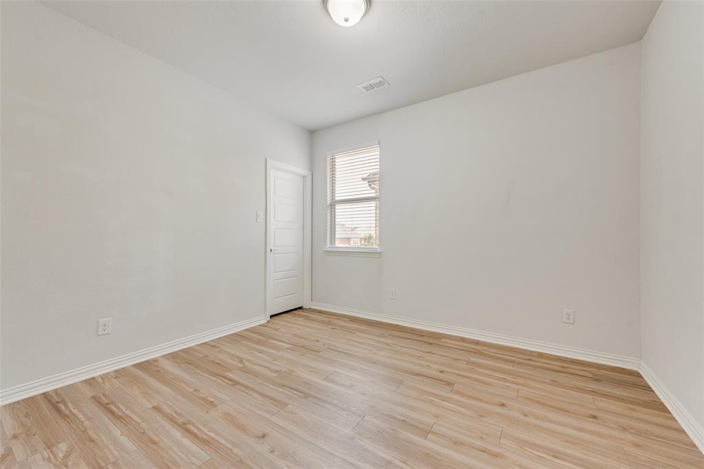 628 Ansley Way Allen, TX 75013 - Photo 15 of 20 Bright interior room featuring light wood-finish flooring and white walls