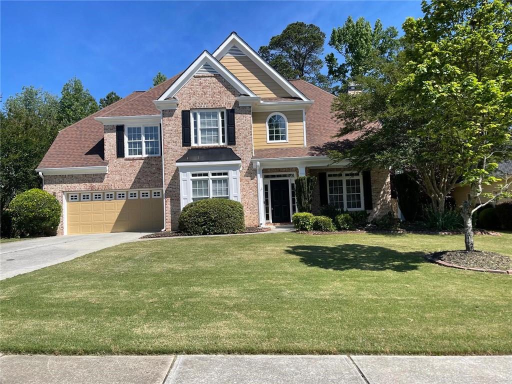 1755 Wheat Grass Way Grayson, GA 30017 - Photo 1 of 42 a front view of a house with a yard