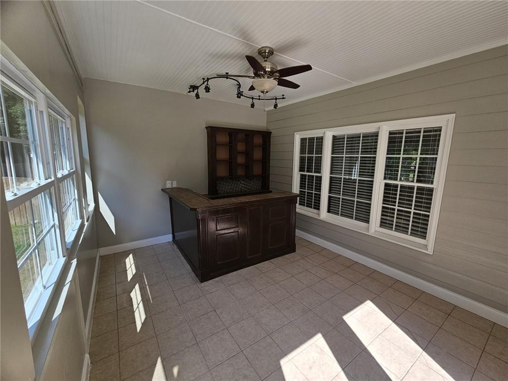 1755 Wheat Grass Way Grayson, GA 30017 - Photo 17 of 42 a view of a livingroom with furniture and a ceiling fan