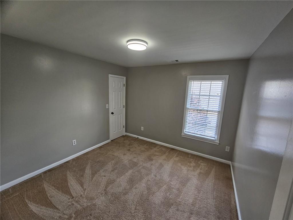 1755 Wheat Grass Way Grayson, GA 30017 - Photo 22 of 42 an empty room with windows