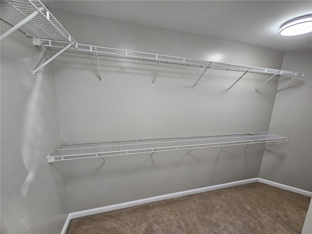 1755 Wheat Grass Way Grayson, GA 30017 - Photo 29 of 42 a view of a room with racks on the wall