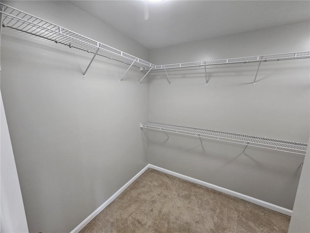 1755 Wheat Grass Way Grayson, GA 30017 - Photo 30 of 42 a view of a room with racks on the wall