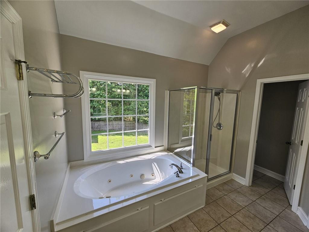 1755 Wheat Grass Way Grayson, GA 30017 - Photo 33 of 42 a bathroom with a tub sink and shower