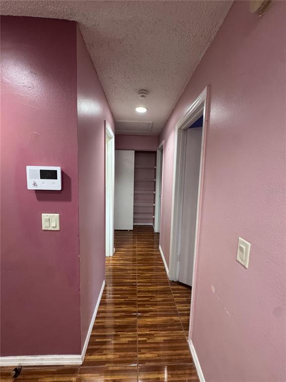 138 Pinewood Circle Kissimmee, FL 34743 - Photo 11 of 26 a view of a hallway with wooden floor