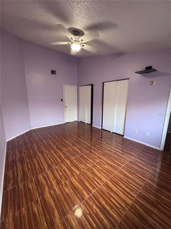 138 Pinewood Circle Kissimmee, FL 34743 - Photo 13 of 26 a big room with wooden floor