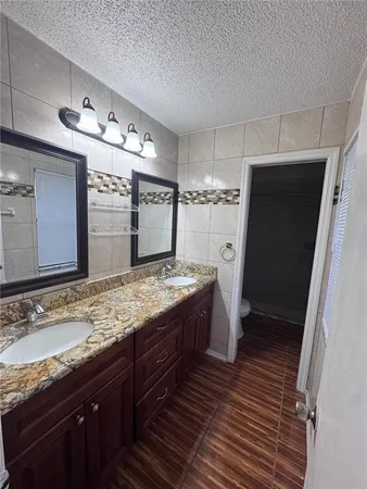 a bathroom with a shower and a toilet