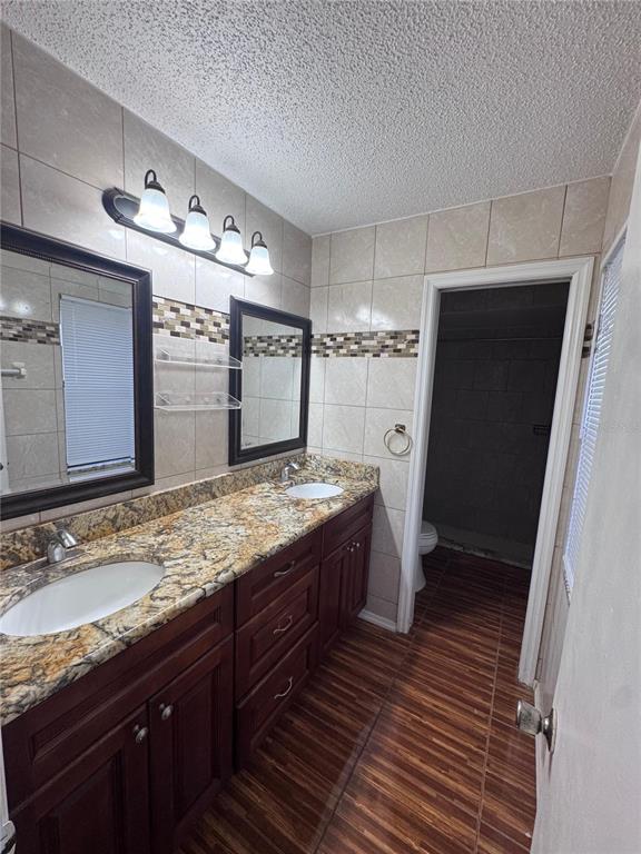 138 Pinewood Circle Kissimmee, FL 34743 - Photo 17 of 26 a bathroom with a sink and a mirror
