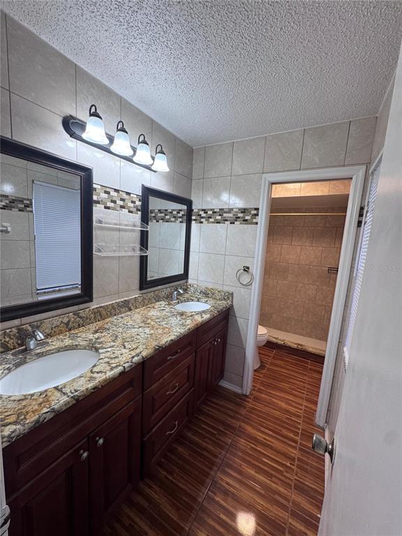 138 Pinewood Circle Kissimmee, FL 34743 - Photo 19 of 26 a bathroom with a sink and a mirror