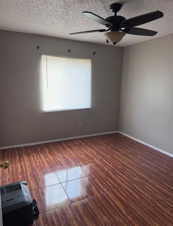 138 Pinewood Circle Kissimmee, FL 34743 - Photo 20 of 26 an empty room with windows