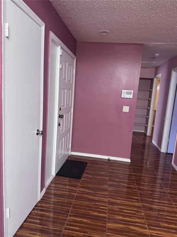 138 Pinewood Circle Kissimmee, FL 34743 - Photo 2 of 26 a view of a hallway with wooden floor