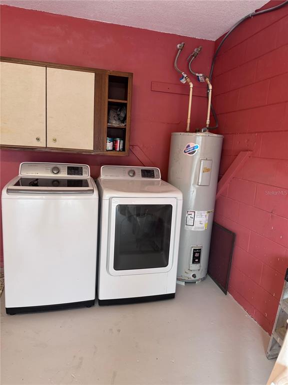 138 Pinewood Circle Kissimmee, FL 34743 - Photo 24 of 26 a utility room with dryer and washer