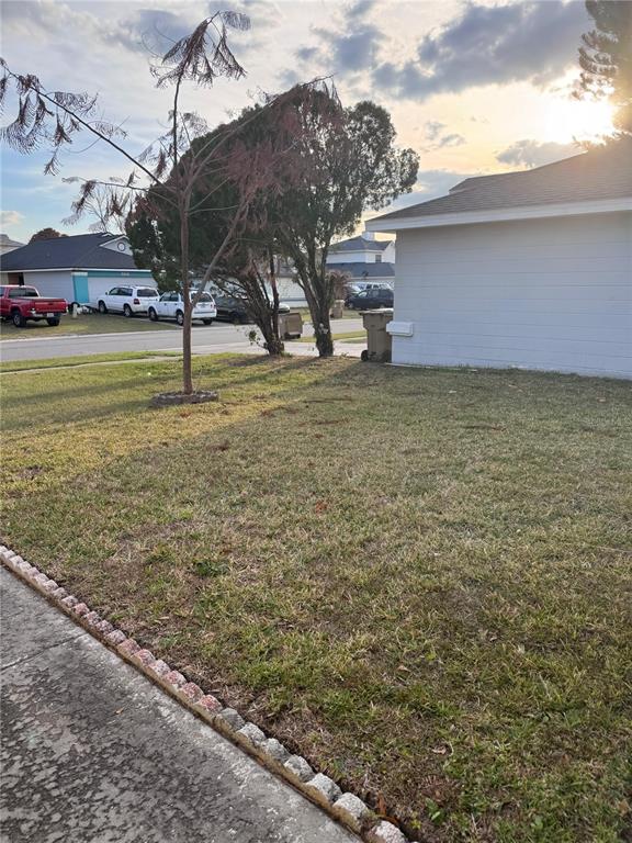 138 Pinewood Circle Kissimmee, FL 34743 - Photo 25 of 26 a view of a patio with a yard