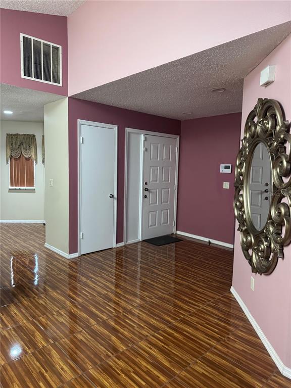 138 Pinewood Circle Kissimmee, FL 34743 - Photo 3 of 26 a view of a livingroom with wooden floor