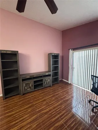 a view of a livingroom with furniture and wooden floor