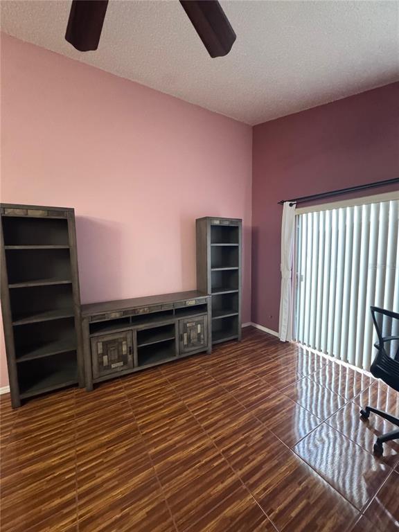 138 Pinewood Circle Kissimmee, FL 34743 - Photo 4 of 26 a view of a livingroom with furniture and wooden floor