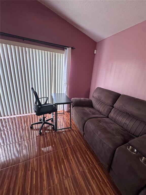 138 Pinewood Circle Kissimmee, FL 34743 - Photo 5 of 26 a living room with furniture and a wooden floor