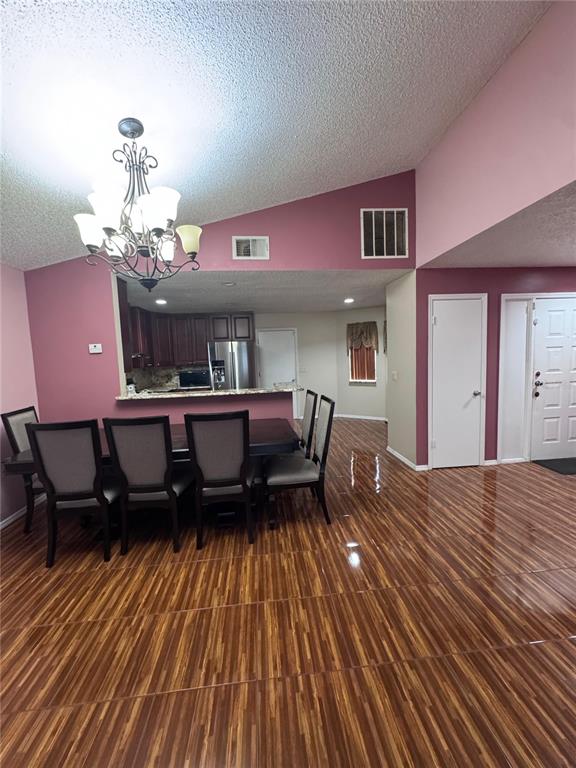 138 Pinewood Circle Kissimmee, FL 34743 - Photo 6 of 26 a living room with furniture and a chandelier