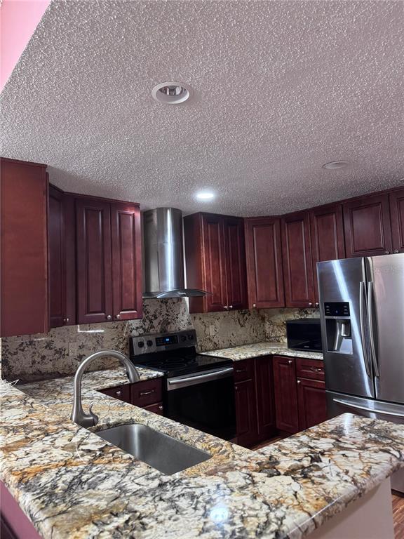 138 Pinewood Circle Kissimmee, FL 34743 - Photo 8 of 26 a kitchen with a refrigerator sink and cabinets