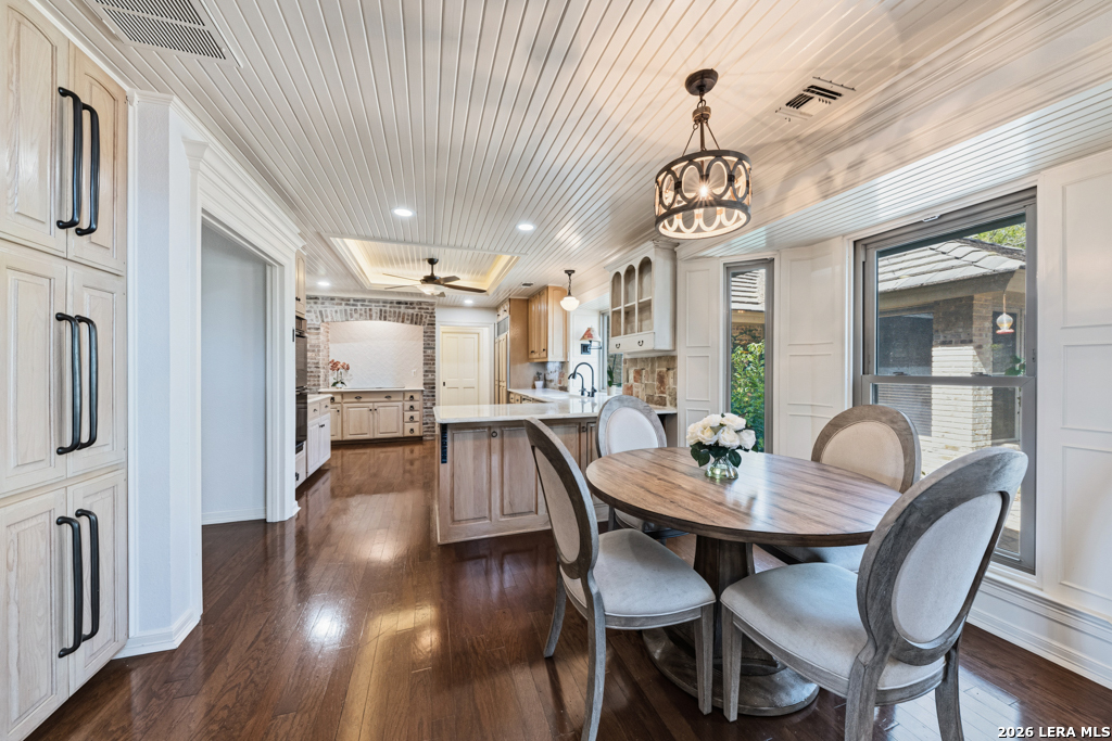 21749 Forest Waters Circle Garden Ridge, TX 78266 - Photo 11 of 50 a view of a dining room with furniture wooden floor and a chandelier