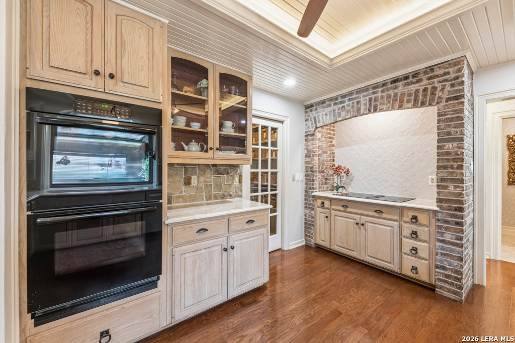 21749 Forest Waters Circle Garden Ridge, TX 78266 - Photo 13 of 50 a kitchen with granite countertop cabinets stainless steel appliances and wooden floor