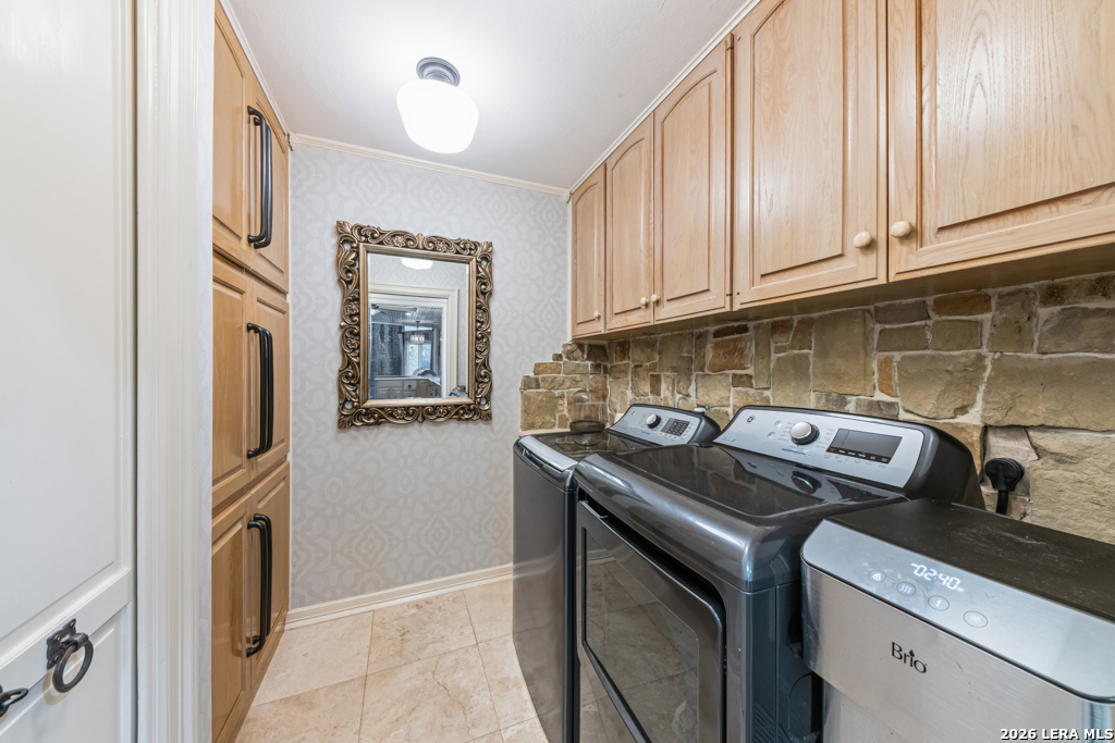 21749 Forest Waters Circle Garden Ridge, TX 78266 - Photo 16 of 50 a utility room with dryer and washer