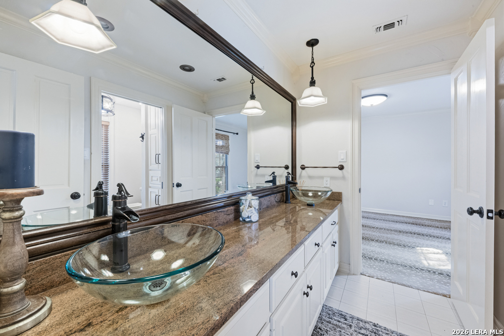 21749 Forest Waters Circle Garden Ridge, TX 78266 - Photo 22 of 50 a bathroom with a granite countertop sink and a mirror
