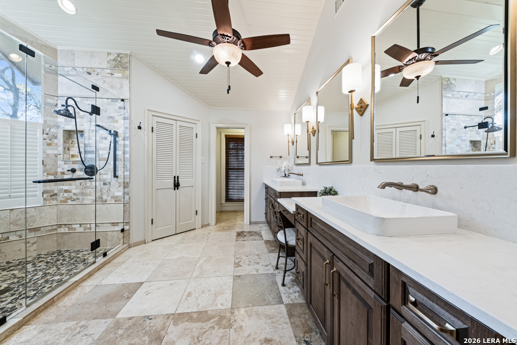 21749 Forest Waters Circle Garden Ridge, TX 78266 - Photo 28 of 50 a spacious bathroom with a sink double vanity and shower
