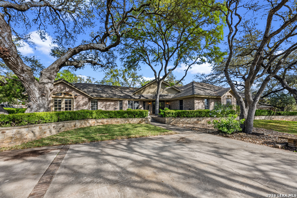 21749 Forest Waters Circle Garden Ridge, TX 78266 - Photo 3 of 50 a front view of a house with a yard