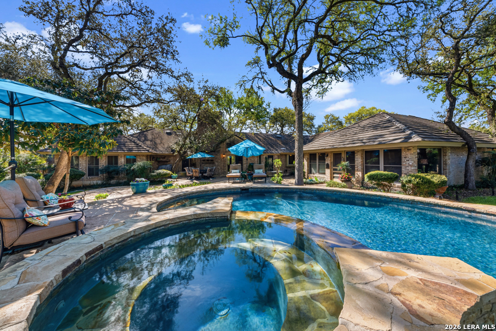 21749 Forest Waters Circle Garden Ridge, TX 78266 - Photo 35 of 50 a view of a house with swimming pool and sitting area