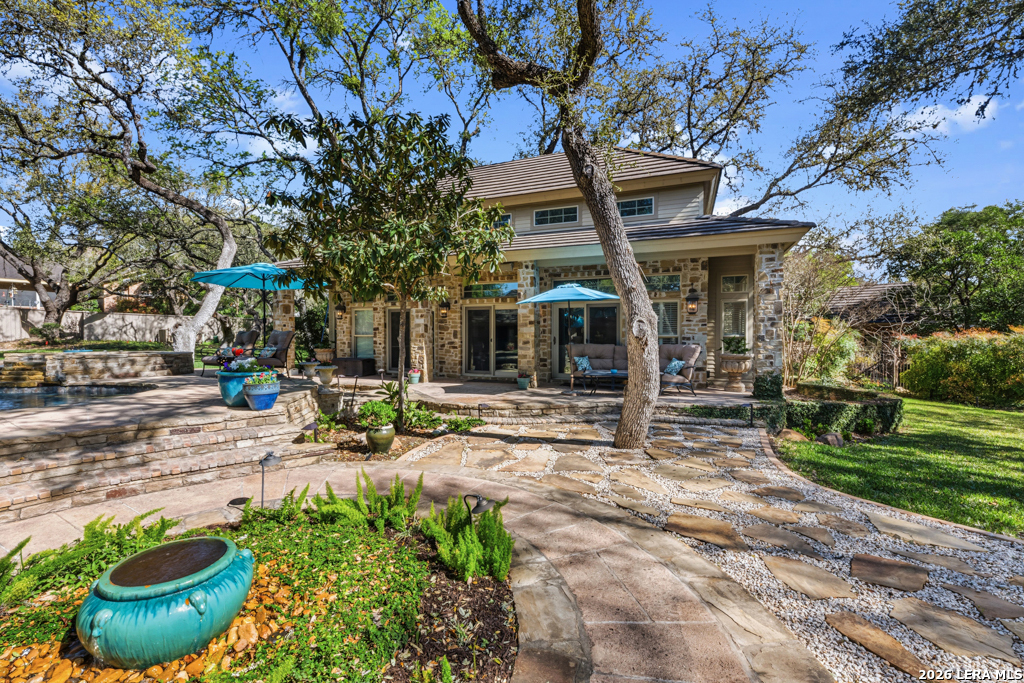 21749 Forest Waters Circle Garden Ridge, TX 78266 - Photo 36 of 50 a view of a chair and table in backyard