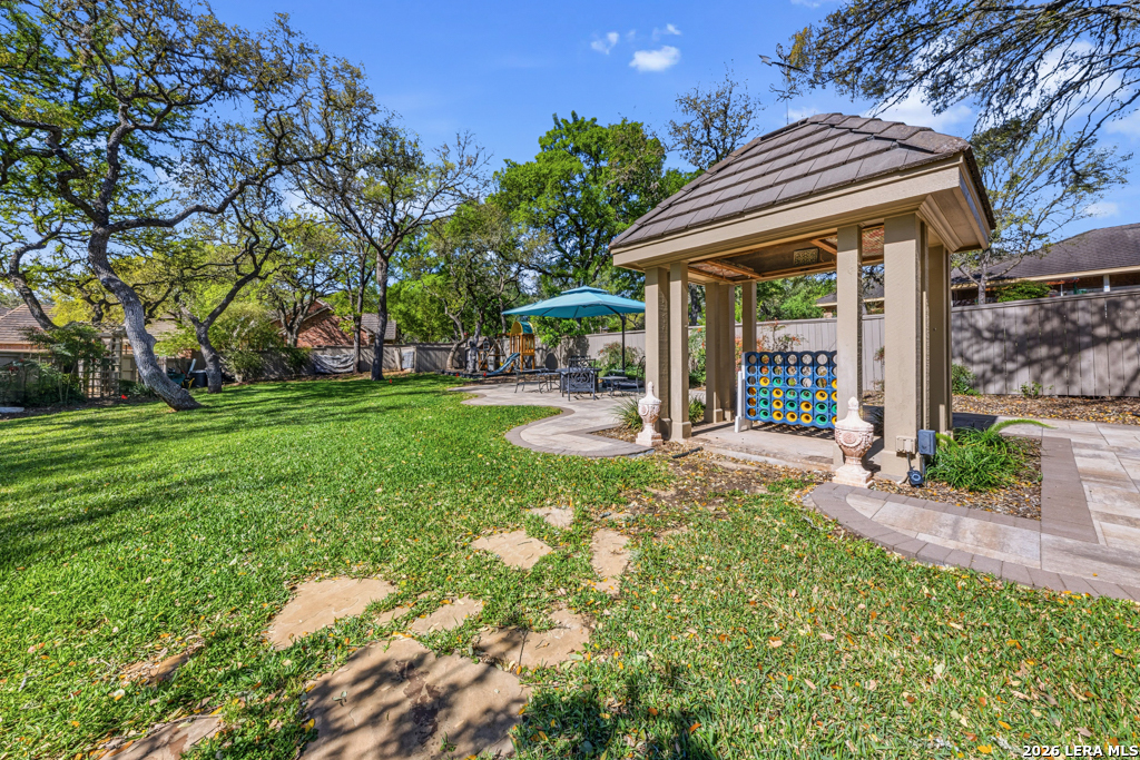 21749 Forest Waters Circle Garden Ridge, TX 78266 - Photo 46 of 50 a view of a house with backyard and porch