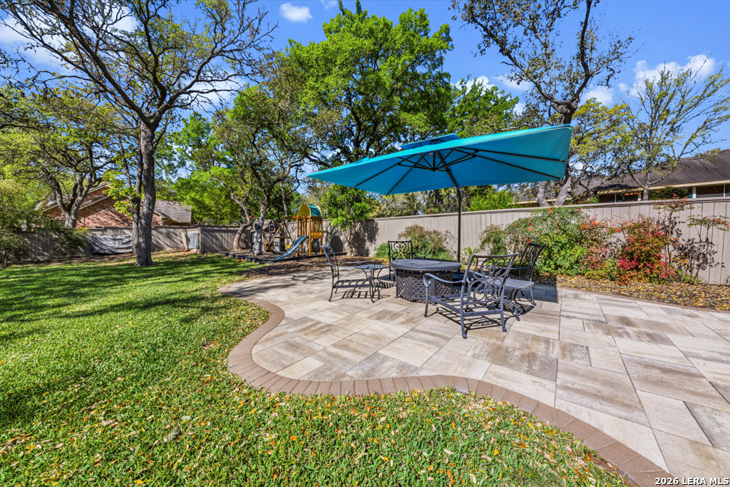 21749 Forest Waters Circle Garden Ridge, TX 78266 - Photo 47 of 50 a view of a backyard with sitting area