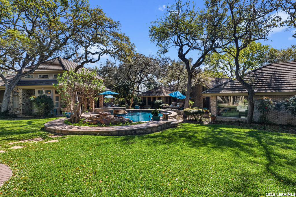 21749 Forest Waters Circle Garden Ridge, TX 78266 - Photo 48 of 50 a view of a house with backyard and sitting area