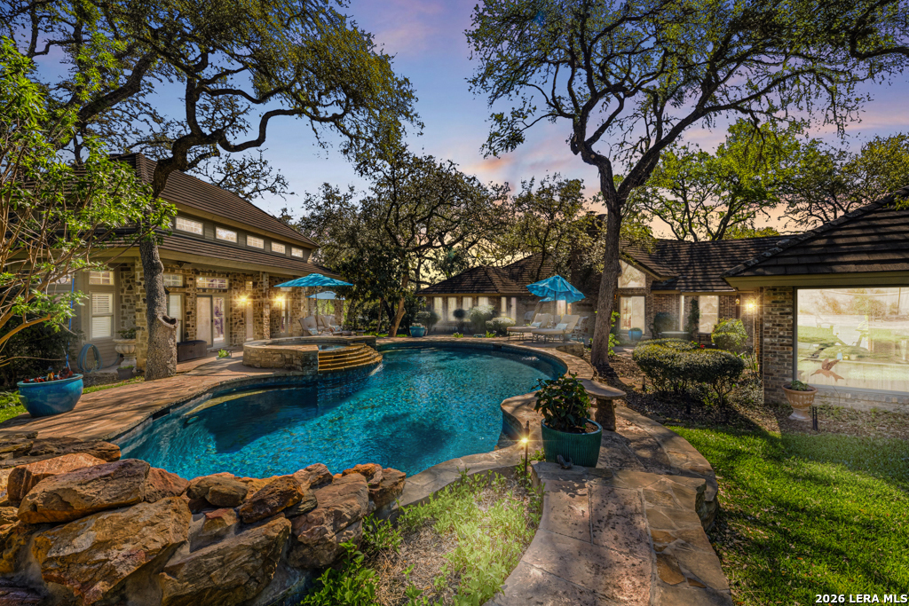 21749 Forest Waters Circle Garden Ridge, TX 78266 - Photo 50 of 50 a view of a swimming pool with a patio and a yard