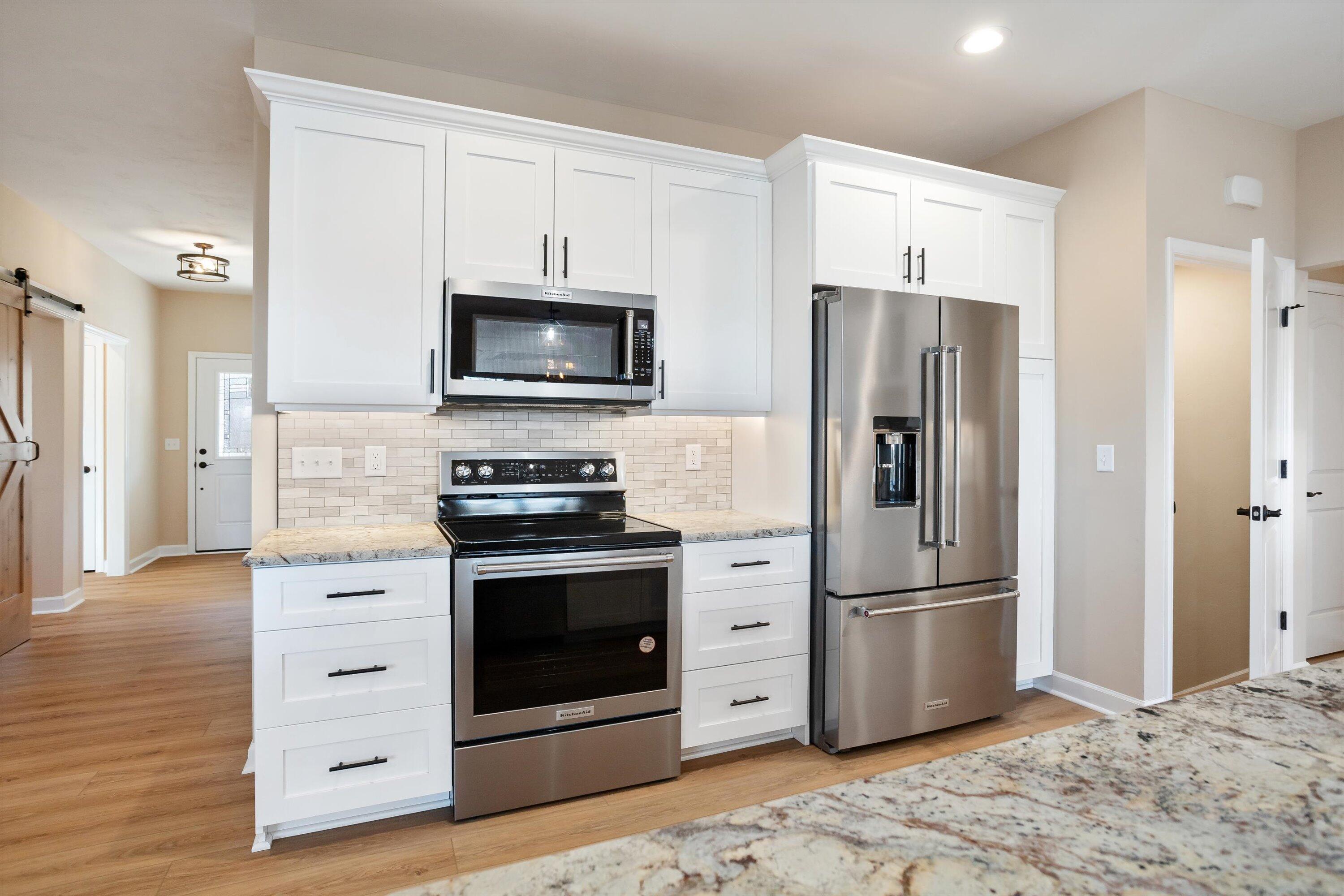 129 Walnut Trace Drive Hardy, VA 24101 - Photo 15 of 42 a kitchen with stainless steel appliances white cabinets a refrigerator and a stove top oven