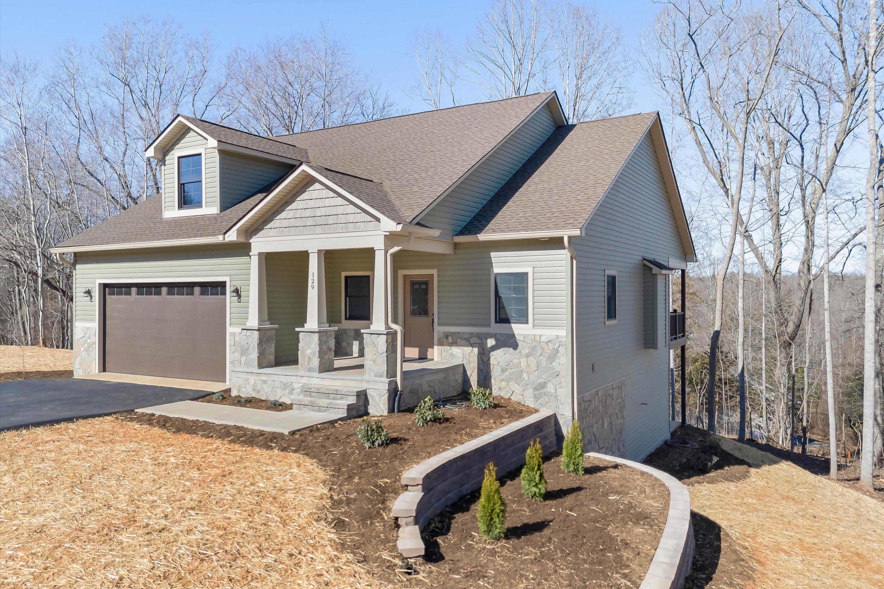 129 Walnut Trace Drive Hardy, VA 24101 - Photo 2 of 42 a front view of a house with garden