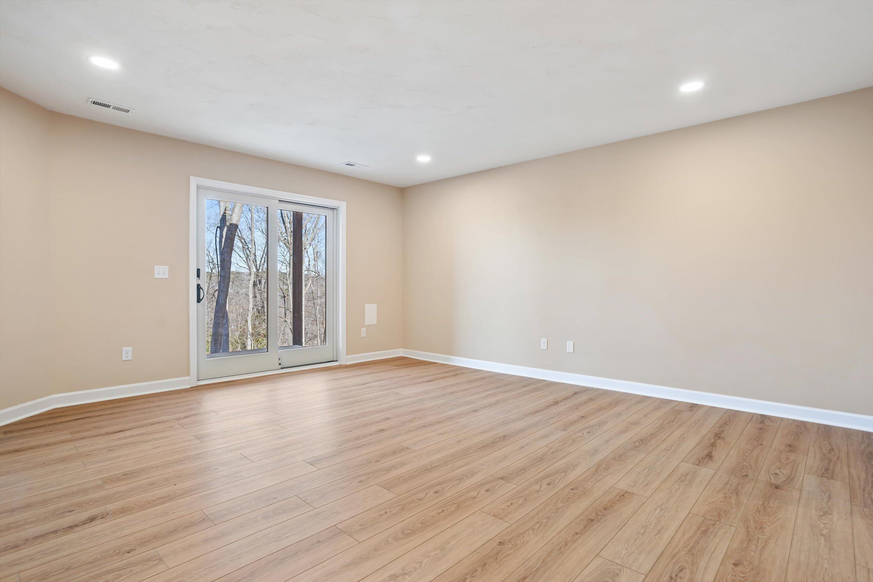 129 Walnut Trace Drive Hardy, VA 24101 - Photo 28 of 42 a view of an empty room with wooden floor and a window