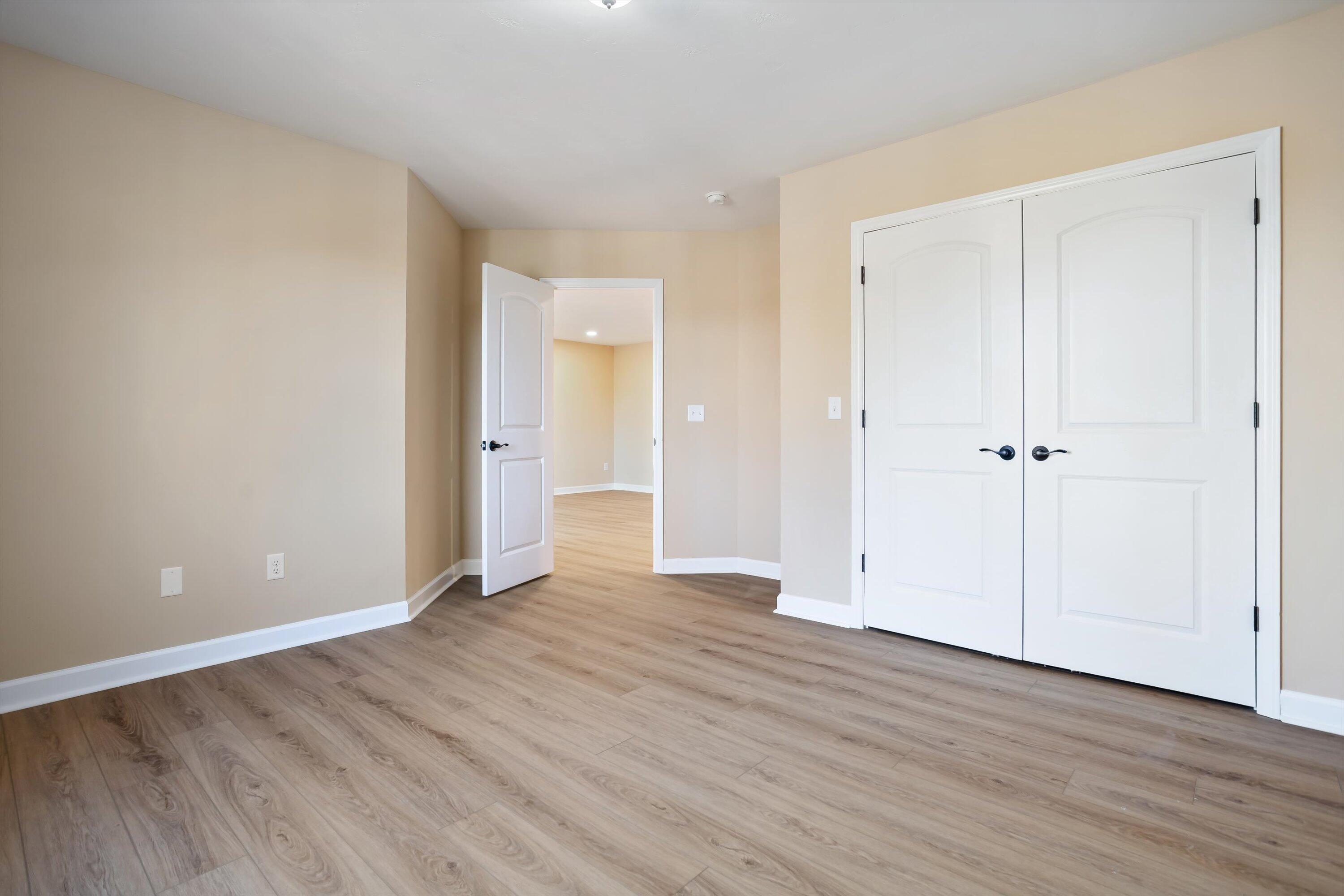 129 Walnut Trace Drive Hardy, VA 24101 - Photo 32 of 42 an empty room with wooden floor and closet area