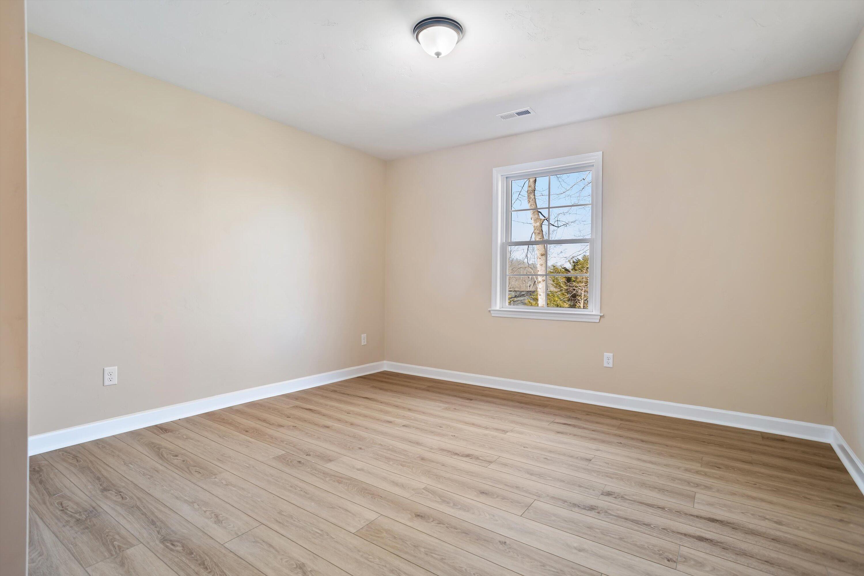 129 Walnut Trace Drive Hardy, VA 24101 - Photo 34 of 42 wooden floor in an empty room with a window