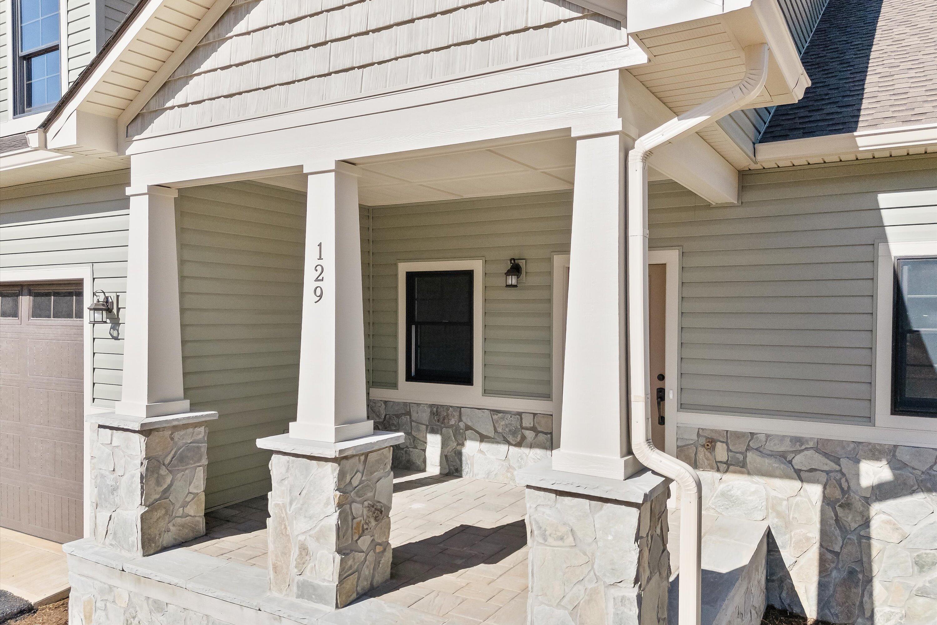 129 Walnut Trace Drive Hardy, VA 24101 - Photo 4 of 42 a front view of a house with outdoor seating