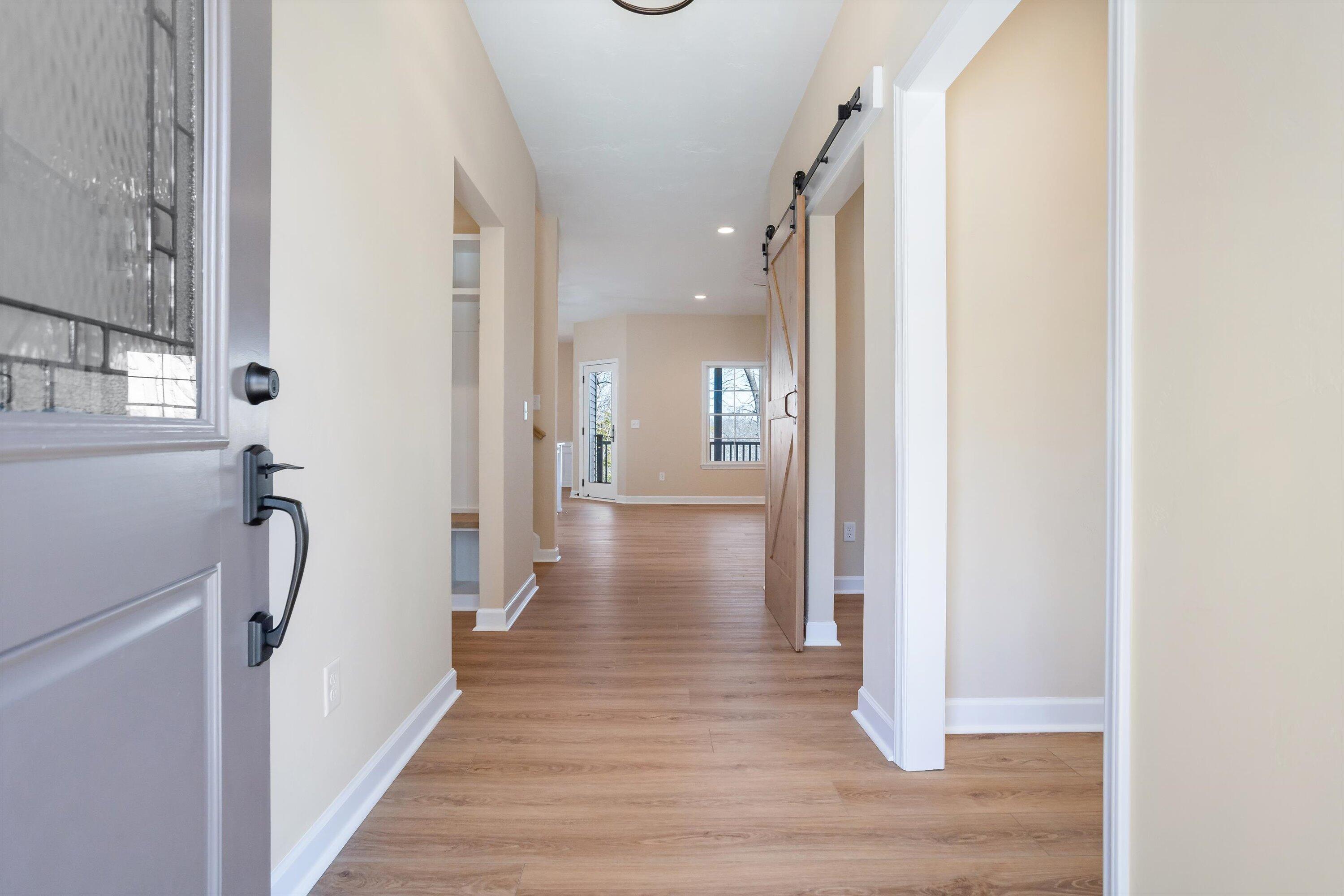129 Walnut Trace Drive Hardy, VA 24101 - Photo 7 of 42 a view of a hallway with wooden floor and staircase
