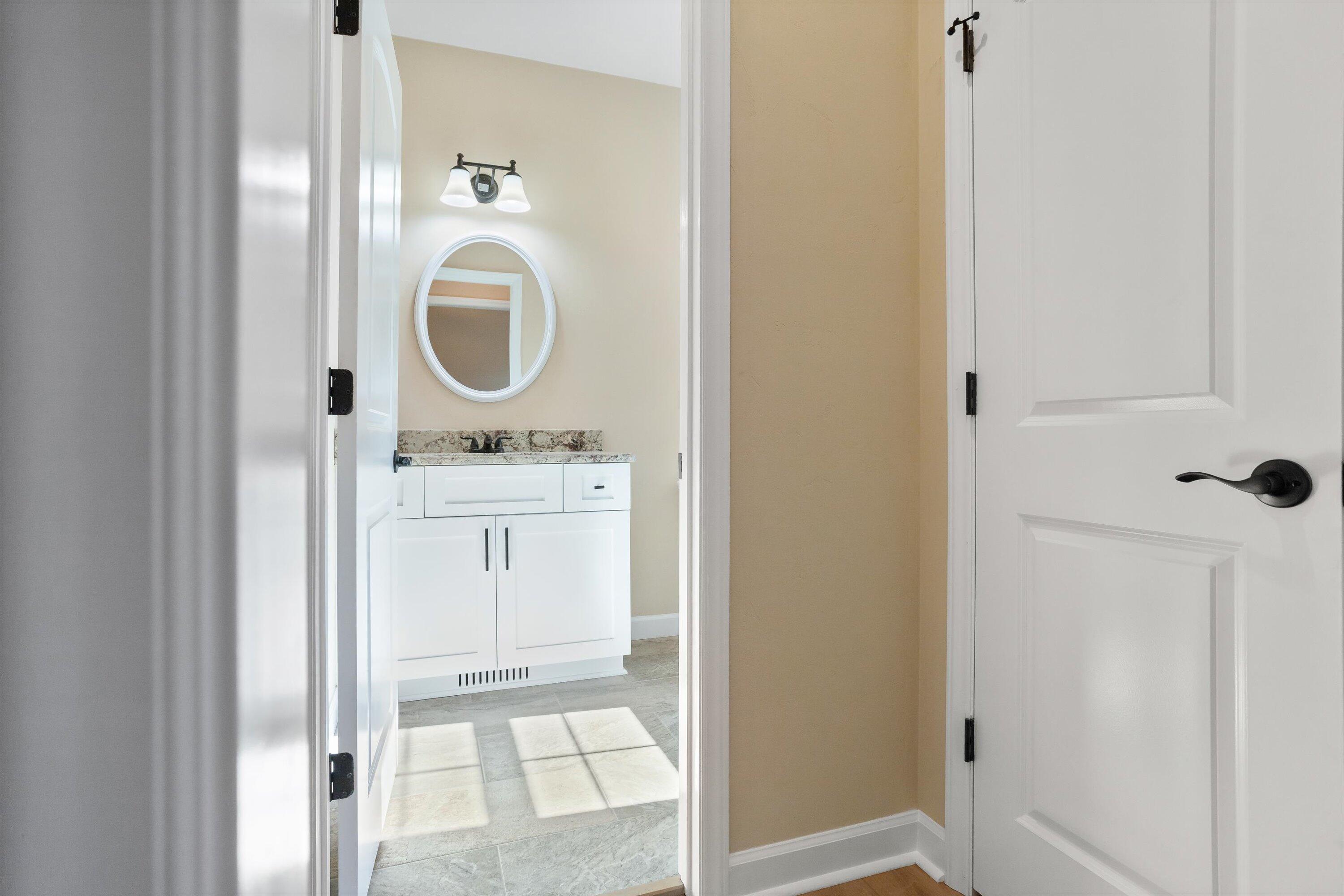 129 Walnut Trace Drive Hardy, VA 24101 - Photo 9 of 42 a bathroom with a sink a mirror and a shower
