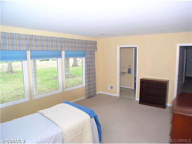 10930 Pegwell Drive Midlothian, VA 23113 - Photo 11 of 12 a bedroom with a bed and a large window