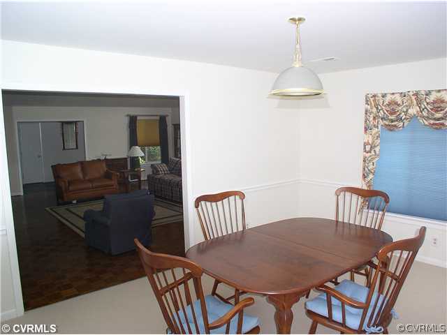 10930 Pegwell Drive Midlothian, VA 23113 - Photo 7 of 12 a dining room with furniture and wooden floor