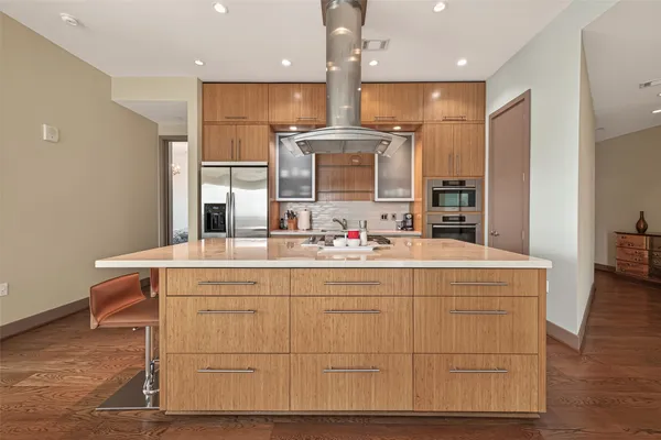 a bathroom with a sink mirror and a bathtub