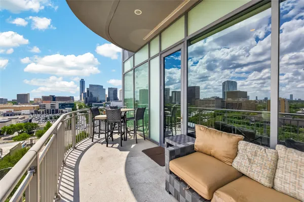 a view of a patio with couches table and chairs