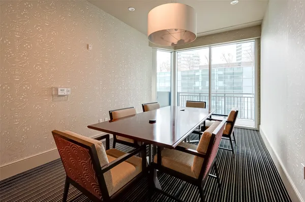 a view of a room with lots of gym equipment