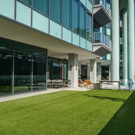 a lobby with furniture and a chandelier