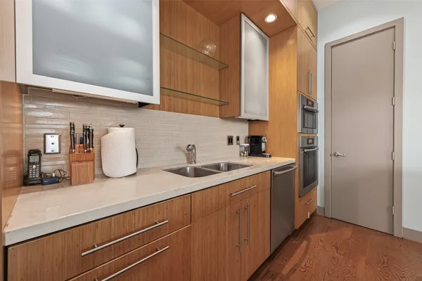 a kitchen with a sink and cabinets